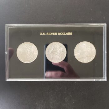 Three $1 Morgan Silver Dollars in a Plastic Holder