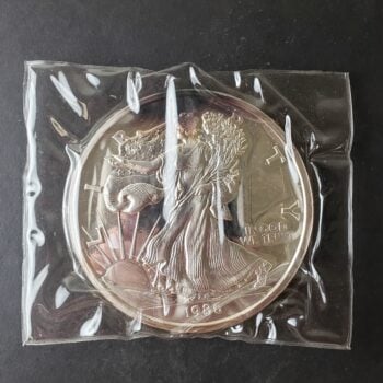 1986 Proof 12oz Silver Walker Round in Plastic at 50c/oz Over Spot